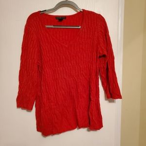 Long-sleeved red v-neck sweater